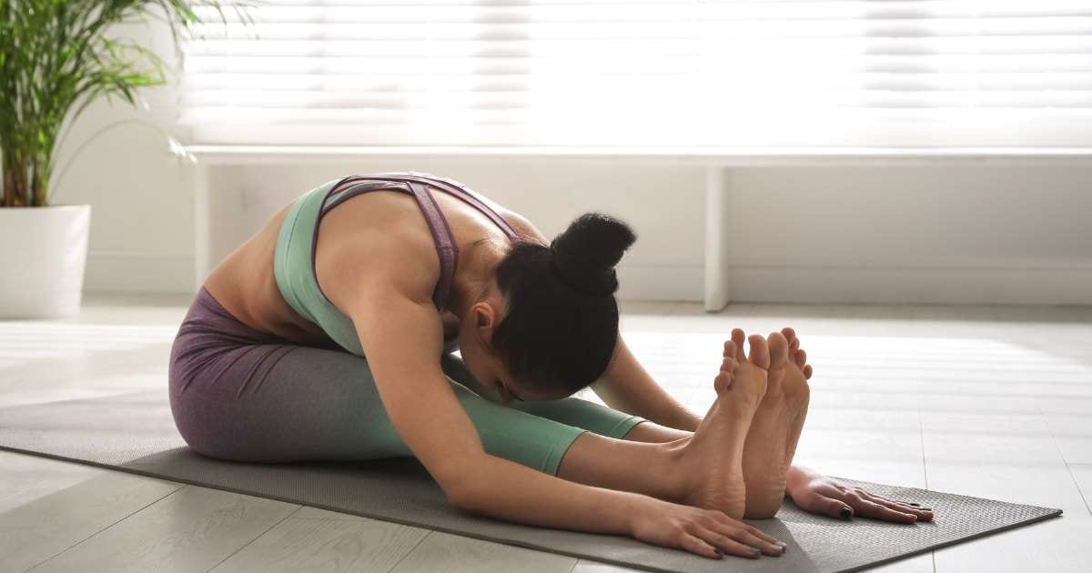 Yoga Seated Forward Bend Pose / Canva