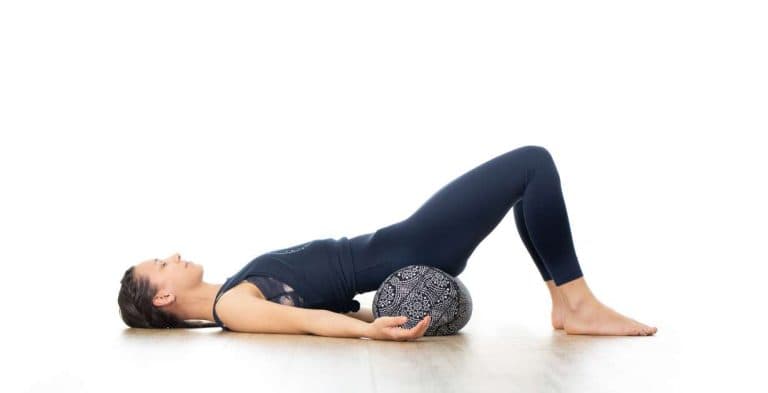 Bridge Pose with Bolster / Canva