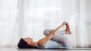 Happy Baby Pose (Ananda Balasana) / Canva