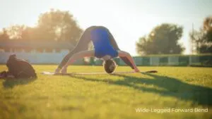 Wide-Legged Forward Bend / Canva