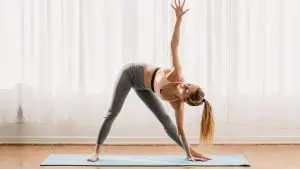 yoga triangle pose / Canva